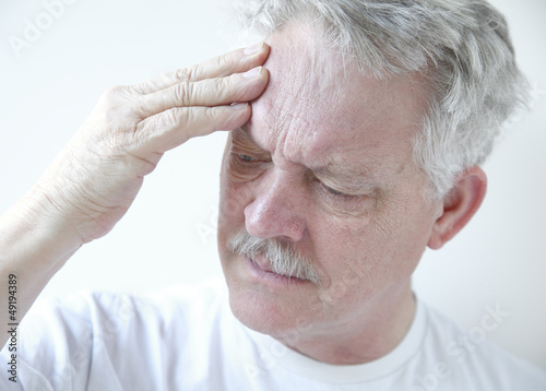 Photo: senior with headache senior with headache