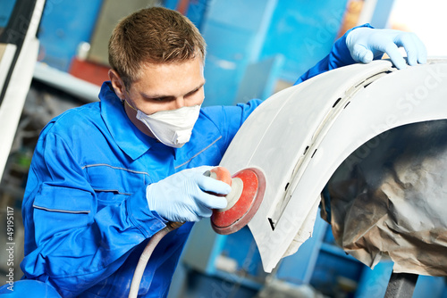 Photo: auto mechanic polishing car auto mechanic polishing car