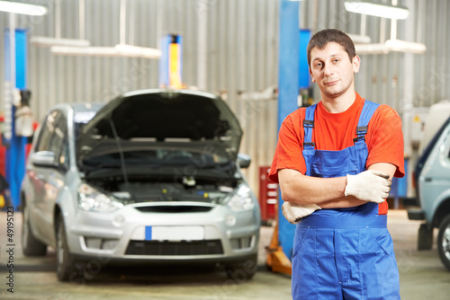 Photo: Repairman auto mechanic inspector Repairman auto mechanic inspector