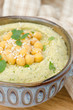 Hummus with cilantro, closeup, selective focus