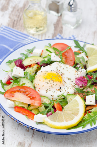 Photo: Vegetable salad with poached egg, vertical Vegetable salad with poached egg, vertical