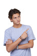 Handsome young guy pointing upwards against a white background
