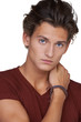 Serious looking young guy against a white background - Cropped
