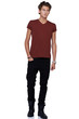 Casual young guy standing against a white background