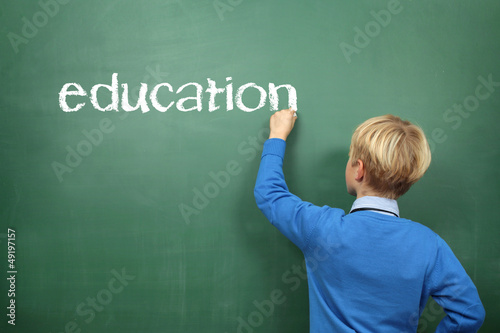 Photo: Education Schoolboy at the Blackboard Education Schoolboy at the Blackboard