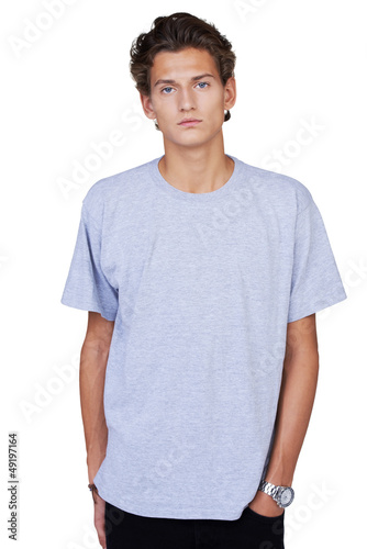 Photo: Serious young guy with his hands in his pockets Serious young guy with his hands in his pockets