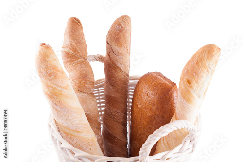 Photo: bread in wicker basket isolated on white bread in wicker basket isolated on white