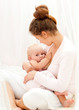 Mother breast feeding her infant