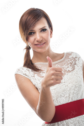 Photo: Young Caucasian woman showing thumb up Young Caucasian woman showing thumb up
