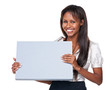 Studio shot of an attractive woman holding up a blank sign for c