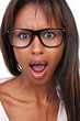 Close up studio portrait of a shocked-looking african american w