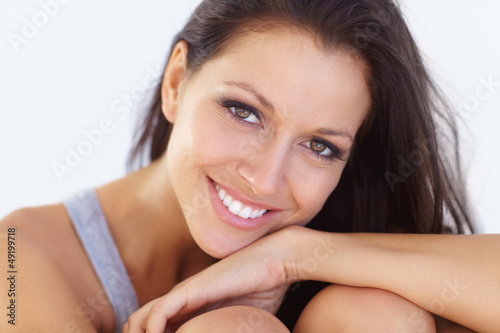 Photo: Portrait of a beautiful young woman with gorgeous eyes smiling a Portrait of a beautiful young woman with gorgeous eyes smiling a