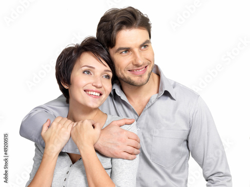 Photo: Portrait of happy couple look into the distance Portrait of happy couple look into the distance