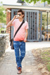 A hipster walking outside