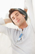 A portrait of a relaxed male relaxing and listening music