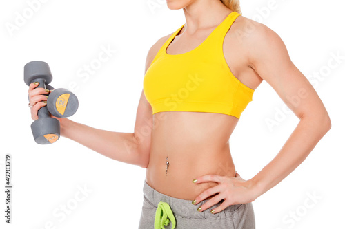 Photo: woman with dumb-bells in hand woman with dumb-bells in hand