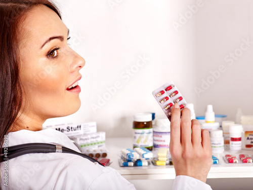 Photo: Doctor holding remedy. Doctor holding remedy.