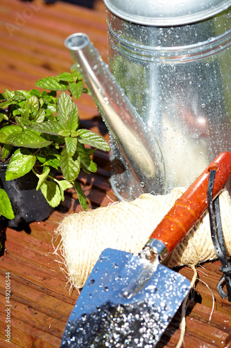 Photo: Outdoor gardening tools and flowers Outdoor gardening tools and flowers