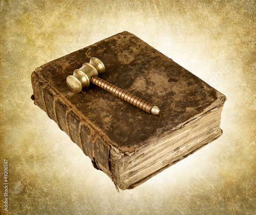Photo: vintage gavel on book vintage gavel on book