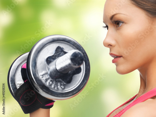 Photo: woman with dumbbells woman with dumbbells