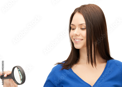 Photo: woman with magnifying glass woman with magnifying glass