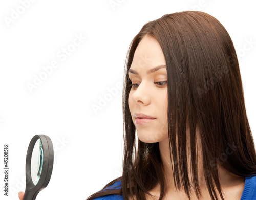Photo: woman with magnifying glass woman with magnifying glass