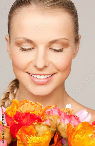 Photo: woman with red flowers woman with red flowers