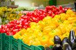 Photo: Bunch of yellow and red paprika pepers on boxes in supermarket Bunch of yellow and red paprika pepers on boxes in supermarket