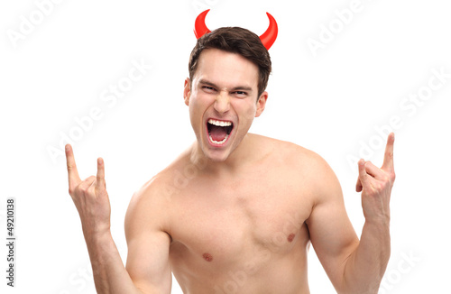 Photo: Man wearing devil horns Man wearing devil horns