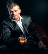 Mafia boss in the red chair. dramatic lighting