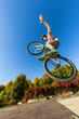 boy going airborne with his dirt bike