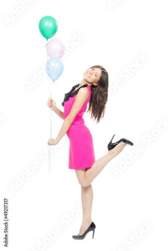 Photo: Young happy girl with colorfull balloons Young happy girl with colorfull balloons