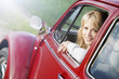Foto: Beautiful woman in red car. Beautiful woman in red car.