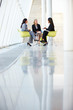Three Businesswomen Meeting Around Table In Modern Office