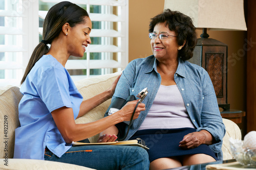 Photo: Nurse Visiting Senior Female Patient At Home Nurse Visiting Senior Female Patient At Home
