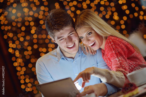 Photo: young couple with a tablet computer young couple with a tablet computer