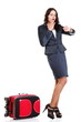 Full length young business woman to late red travel bag
