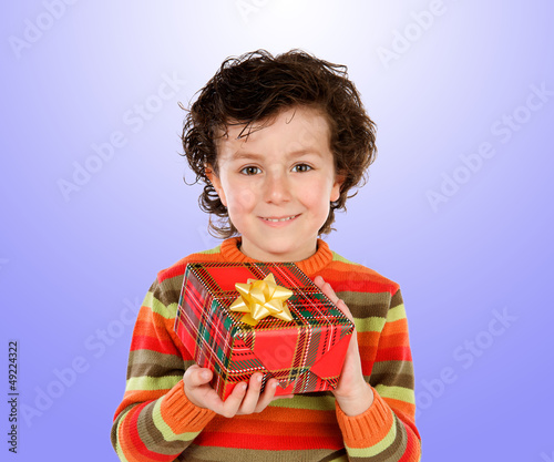Photo: Beautiful child giving a present Beautiful child giving a present