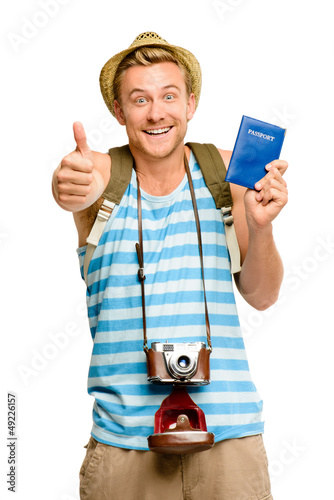 Photo: Happy tourist thumbs up passport retro camera isolated on white Happy tourist thumbs up passport retro camera isolated on white