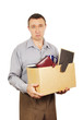 Dismissed man with cardboard box