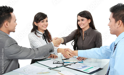 Photo: business team making a deal business team making a deal