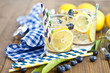 Homemade lemonade with lemons and blueberries