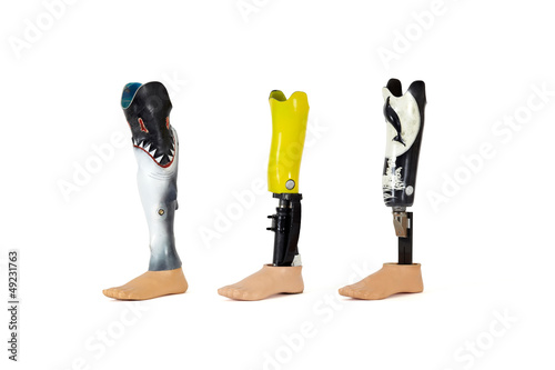 Photo: Three prosthetic legs. Three prosthetic legs.