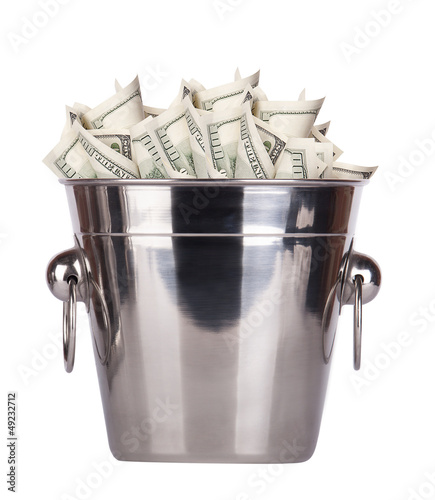 Photo: Bucket with money on white background Bucket with money on white background