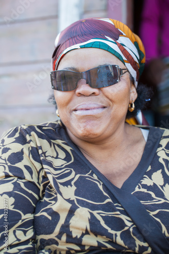 Photo: African woman with sunglasses. African woman with sunglasses.