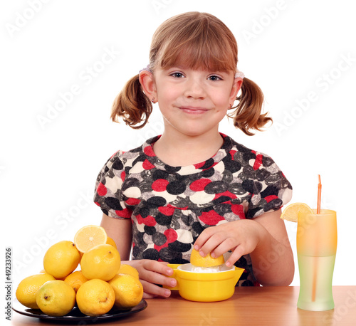 Photo: happy little girl make lemonade happy little girl make lemonade