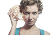 Foto: girl with a sea shell to your ear girl with a sea shell to your ear