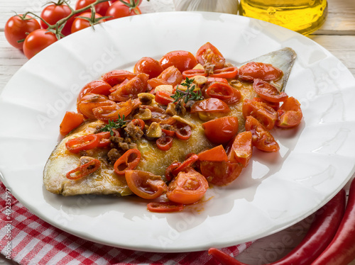 Photo: sole fish with tomato anchovy and hot chili pepper sole fish with tomato anchovy and hot chili pepper