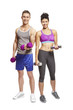Young man and woman exercising in sports outfits