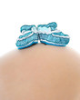 Photo: baby booties on the belly pregnant mom baby booties on the belly pregnant mom